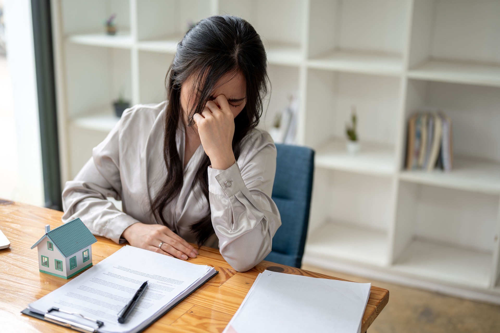 A stressed and upset female homeowner